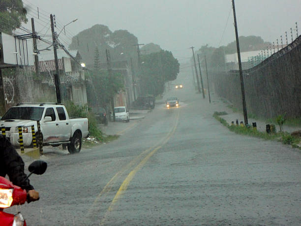 urban scenes with chaotic car traffic in floods and road flooding