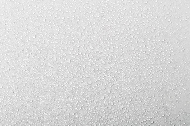 istock Water droplets collect on a smooth surface in a bright, indoor setting during the day 2261568806