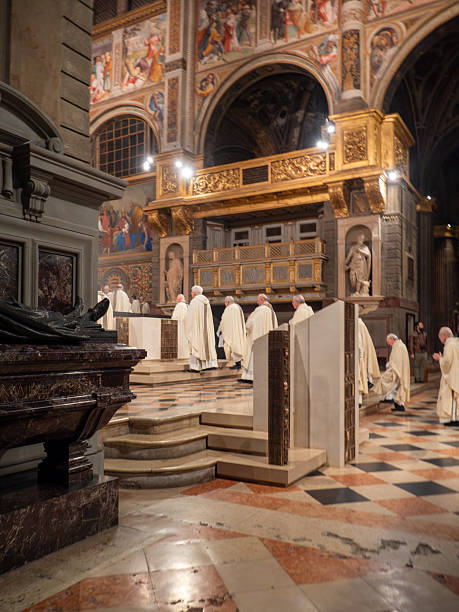 Cremona, Italy February 2nd 2026 Bishops and priests processing through Cremona Cathedral interior during solemn Catholic mass blessing candles amid ornate frescoes