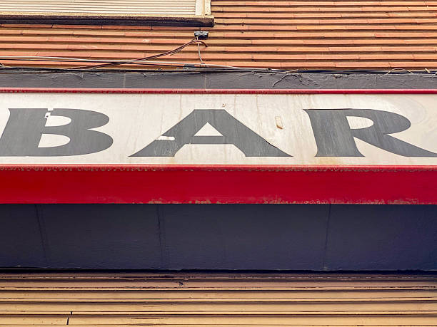 Low angle close-up view of a large sign with the word BAR printed on it in the city of Valencia, Spain