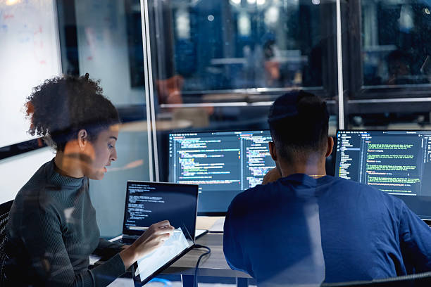 In the complex ecosystem of software development, cross-functional roles work in harmony to deliver user-centric solutions. This collective expertise ensures that every phase of the process is handled with precision. A diverse team of developers collaborates late into the night, developing secure code and patching vulnerabilities. Their focus on risk mitigation ensures a stable, high-quality product that aligns with client expectations. Computerized System Validation Software stock pictures, royalty-free photos & images