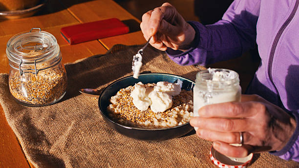 Breakfast of organic porridge, a mix of chia, sesame and flax seeds, then topped with natural homemade yogurt. Part of a series on ZOE nutrition.