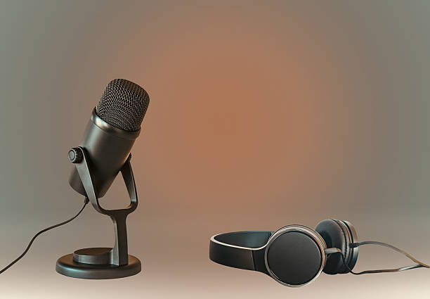 Studio microphone and headphones on minimal background
