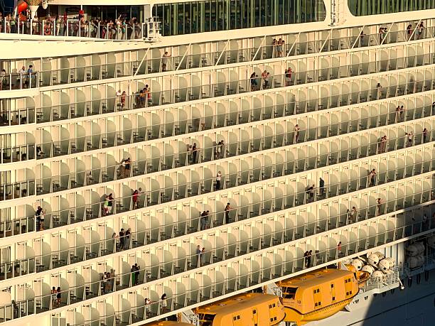 Miami, Florida, United States of America - January 5, 2026: Passengers standing on their individual cruise ship balconies, watching the view and enjoying a relaxing vacation while traveling from the E Port Blvd in Miami, Florida
