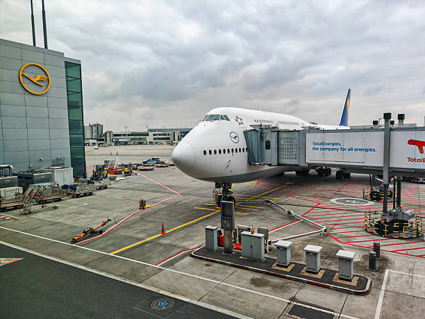 Frankfurt, Germany - February 14, 2025: a Lufthansa Group Boeing 747-8 docked to a passenger boarding bridge at Frankfurt Airport.