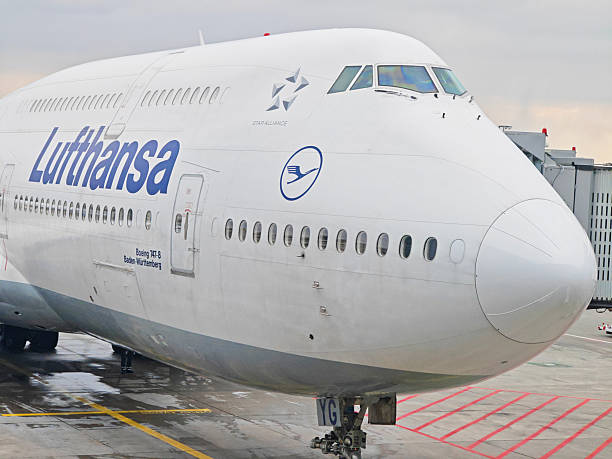 Frankfurt, Germany - February 14, 2025: a Lufthansa Group Boeing 747-8 docked to a passenger boarding bridge at Frankfurt Airport.
