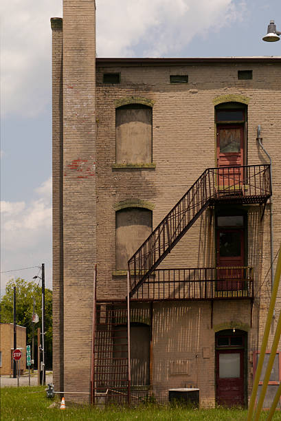A peek behind a three-story prewar brick building in an old, small southern town. Hamlet North Carolina 2025