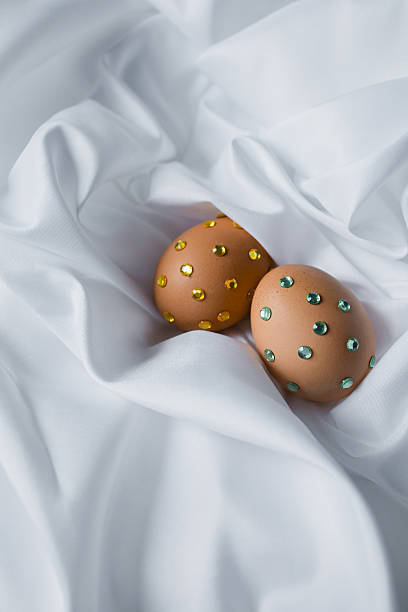 Two Easter eggs decorated with rhinestones. New design vision on Christian Easter traditions, ideas for holiday table
