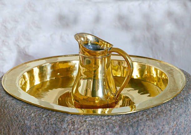 Elegant golden pitcher and basin on a stone base. The reflective surface amplifies the luxurious feel, often used in symbolic rituals or significant events to signify purity and grace.
