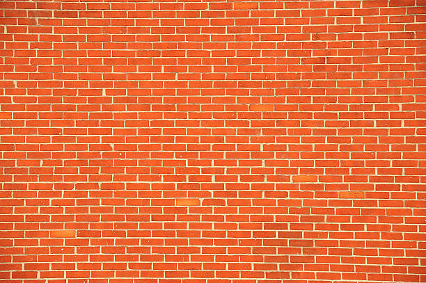 istock facade view of old red brick wall background 2261691324