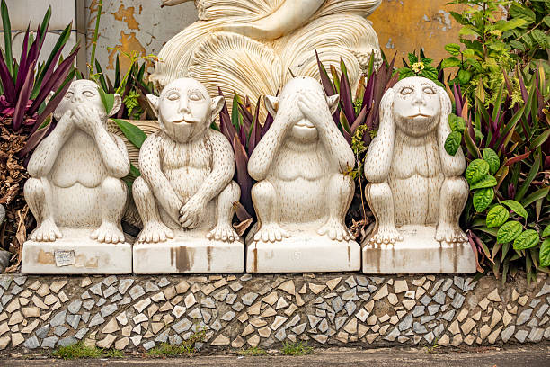 Humorous garden features near Ha Long City in Quang Ninh Province, Vietnam, showing an extra monkey going beyond 'speak, see and hear no evil)