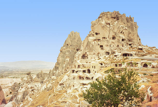 In the town of Ürgüp, in the Cappadocia region of Turkey, the sandstones covered by volcanic eruption have been shaped by wind and natural effects over thousands of years, forming steep columns. In the early days of Christianity, religious men and believers around them built houses and churches on these easily excavated rock formations.