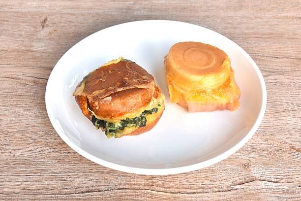Obanyaki grilled Japanese pancake stuffed spinach and chicken ham with cheese