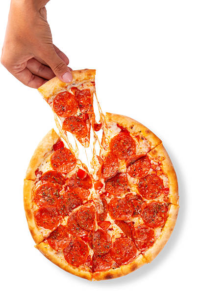 Hand holding pepperoni pizza slice with melted cheese stretch isolated on white background for food delivery menus and advertising