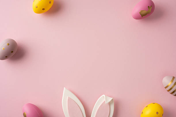 istock Pastel Easter eggs and a bunny ear accent sit against a soft pink backdrop, creating a warm, festive scene perfect for Easter greeting campaigns and spring celebrations 2261777169