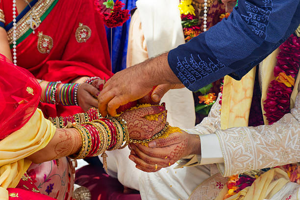 istock Indian Bride and Groom Performing Hastamelap Ritual During Hindu Wedding 2261790971
