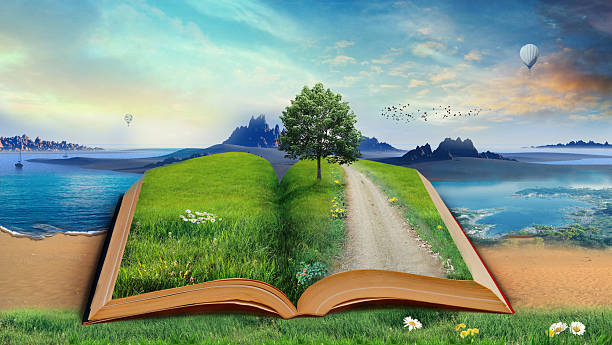 istock Open book reveals a landscape of nature and imagination. 2261795012