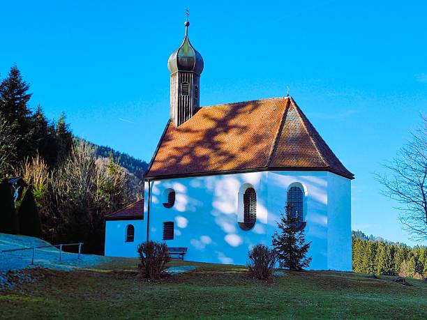 The Plague Chapel near Wackersberg in the winter sunlight