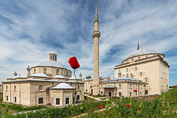 Exterior view of the historic Sultan Bayezid 2 Complex with Ottoman architecture under a blue sky in Edirne, Turkey, shot in May 2022.