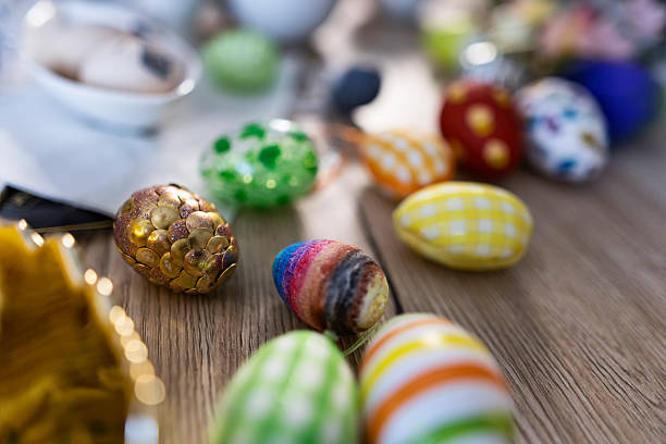 Teenagers painting and crafting Easter eggs. Collection of Easter eggs decorated using many different techniques, including painted patterns, layered colors, dotted designs, and mixed‑media accents. Shot with Canon R5