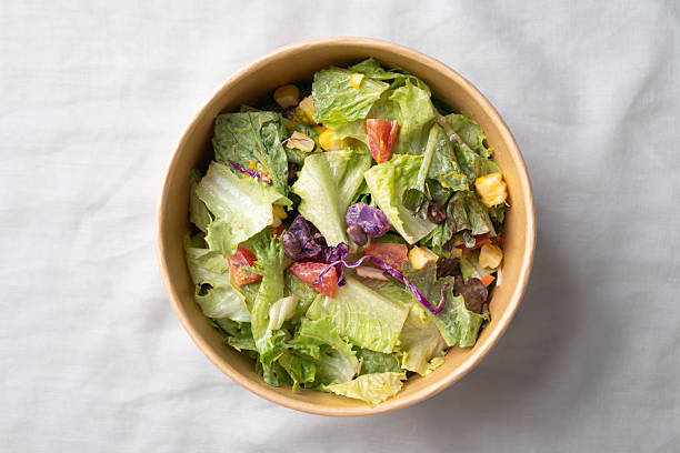 Healthy vegetable salad in a takeout bowl