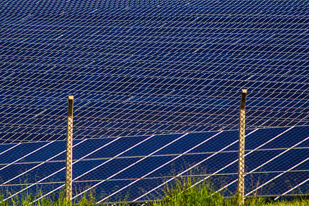 Blue photovoltaic solar panels on a roof. This image captures the intricate pattern of clean energy technology, symbolizing sustainability, renewable power, and green innovation for the future.