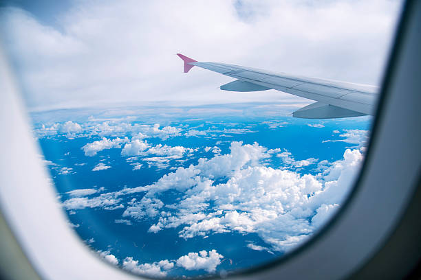 istock 4K Motion sky Aerial view summer tropical blue sky fluffy white cloud summertime sunny day cloudscape. Clear bright blue skyline spring sunlight climate background. Heaven blue environment 2261882663
