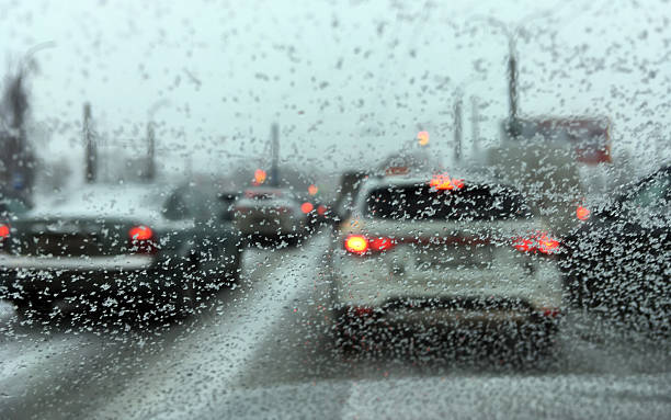 istock View through a windshield of a traffic jam during heavy snowfall. 2261894740