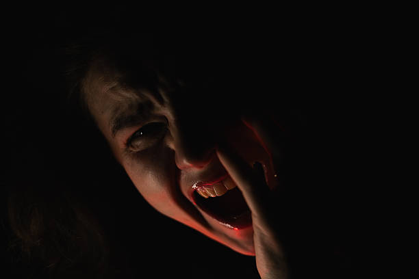 A dramatic portrait of a screaming woman