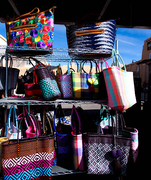 Santa Fe, NM: Santa Fe, NM: Close-Up Retail Display Colorful Mexican Shopping Bags for Sale on a sunny sidewalk in downtown Santa Fe.