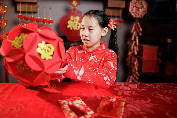 front view of young girl celebrating Chinese New year at home