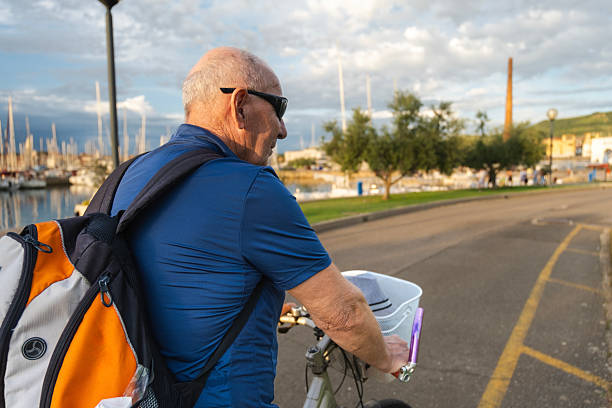 One senior man staying active and healthy in his retirement by driving a bike regularly