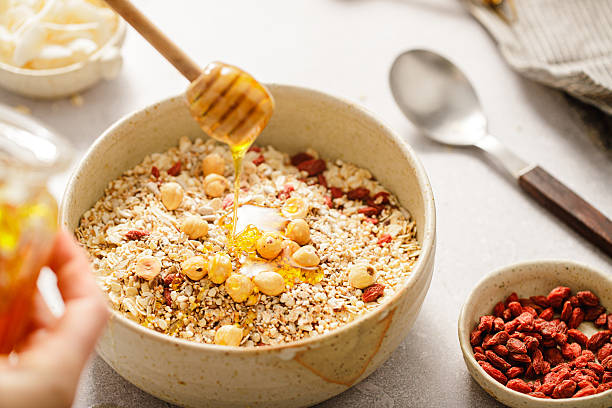 Healthy muesli bowl with honey drizzle and dried goji berries