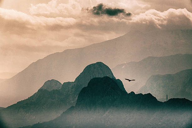 High mountains over cloudy dusk sky stock photo