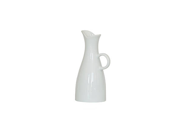 Still life with a white vase with dry lavender bouquet on the bookshelf against white wall background. Copy advertising space. Home decoration. Home interior