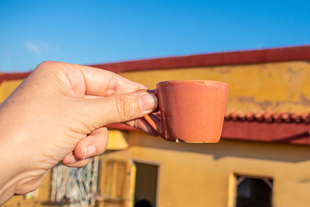 Fluffy coffee mug on brown and soft balloon surface.