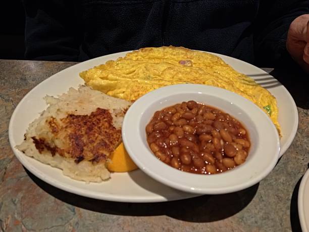 Yummy and colorful veggie omelette with mushrooms and cheese