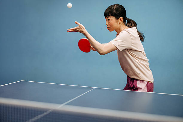 Pair of ping pong paddles and a ping pong ball isolated on white background, table tennis equipment