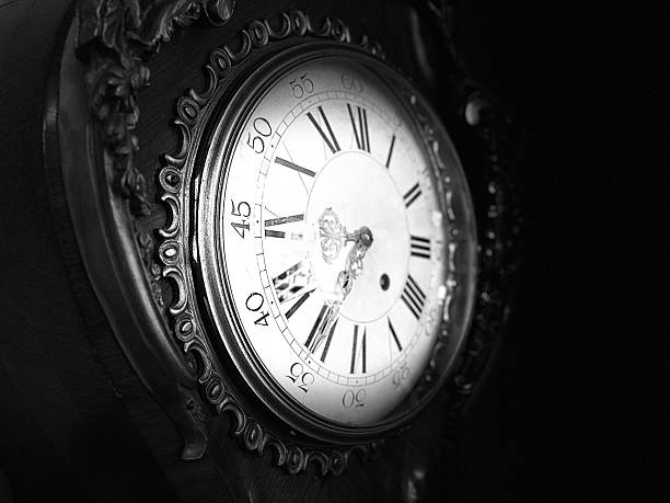 A dramatic black and white close-up of a classic clock face in San Diego.