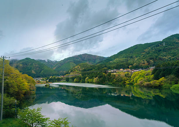 Landscape of Japanese Alps in Gifu prefecture (Honshu, Japan) seen from passing train.