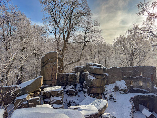 Bolczow Castle ruins in winter, Poland. Snow-covered medieval stone walls in the Rudawy Janowickie Mountains.