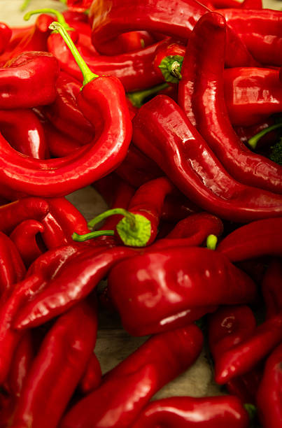 Heap of fresh red paprika peppers