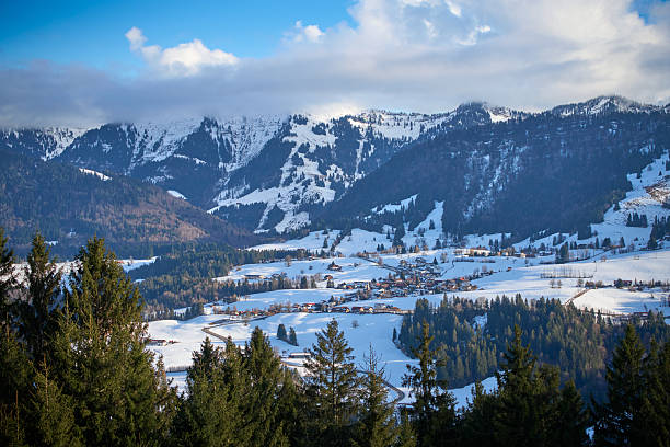 Moountain houses in a beautiful landscape in winter on a sunny day in the Austrian Alps.