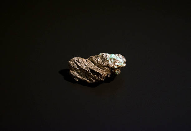 A precious emerald nugget set in phlogopite mica. Beryl, emerald, natural crystal.