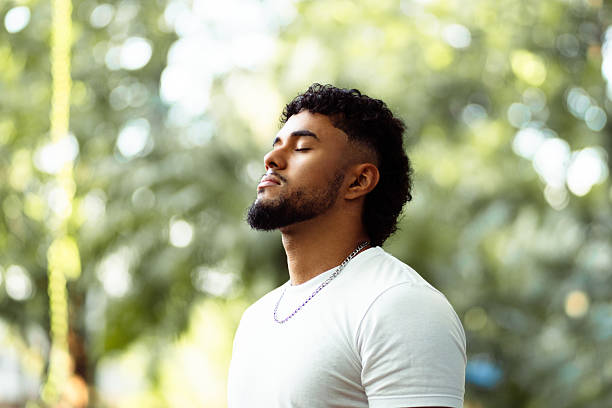 istock Young man meditating outdoors feeling peaceful and serene 2262164178