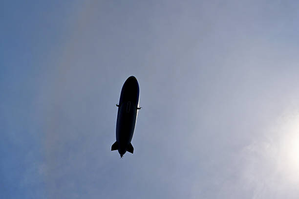 Zeppelin flying in the sky in the German town Konstanz through blue sky.