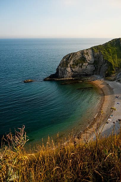 Man O'War Beach on Jurassic Coast, Dorset, England, UK. Scenic bay surrounded by Jurassic Coast rocks. Sunny summer days. beautiful landscape and seascape view. English Channel sea view. Cliffs, rocks.