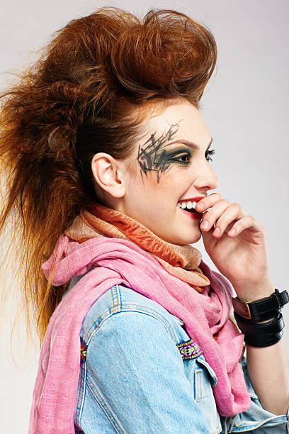 Fashion portrait of a young woman with a mohawk hair do