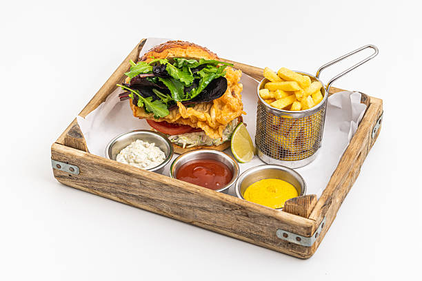 Crispy fried chicken burger served with fries and creamy dips