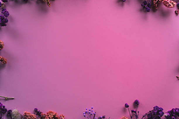 Vibrant spring floral decoration positioned on a purple-pink gradient background with copy space. Bright and festive composition ideal for seasonal designs and creative spring projects.